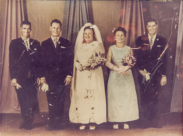 scratched and faded wedding photo for restoration