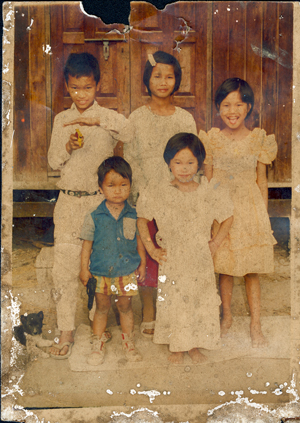 Badly torn, faded, dirty, mildewed photo needs repair and restoration