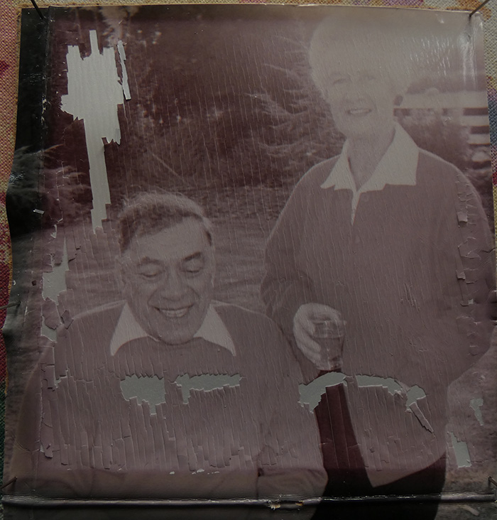 flaking, torn, faded family photo for restoration