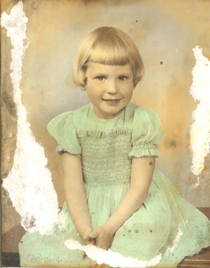 badly torn, mildewed, stained and faded photo needs restoration